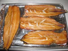 some fish that are sitting on top of tin foil and ready to be cooked in the oven