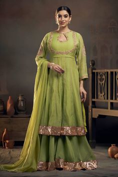 Green chanderi kalidar kurta with floral threadwork and sequins embroidery on neckline and sleeves. Comes with sharara and organza dupatta. - Aza Fashions Floor-length Kundan Sharara With Pallu, Traditional Floor-length Sharara With Gota Work, Traditional Floor-length Gota Work Sharara, Festive Floor-length Sets With Gota Work, Semi-stitched Slub Silk Lehenga With Gota Work, Floor-length Gota Work Sharara For Festive Occasions, Semi-stitched Pista Green Choli For Eid, Festive Floor-length Sharara With Gota Work, Festive Gota Work Floor-length Sharara