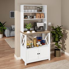 a white shelf with some food on it in a living room next to a potted plant