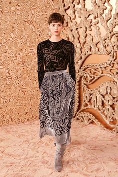 Imbued with stunning graphics, our Valetta Skirt is engineered from burnout velvet with botanical motifs at the center and wavy, animalesque patterns throughout. This silver beauty has a fixed waistband with side pockets and a midi silhouette with a front split for graceful movement. It is fully lined and fastens with a concealed hook and zipper at the side. Composition: 80% Viscose, 20% Silk Botanical Motifs, Nyc Boutiques, Velvet Midi Skirt, Graceful Movement, Burnout Velvet, Knit Maxi Skirt, Knit Denim, Denim Accessories, Knitted Coat