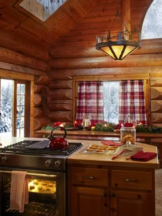 a stove top oven sitting inside of a kitchen next to a counter with food on it