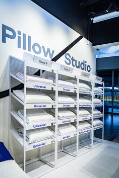 the display case is full of pillows and other items for sale at the showroom