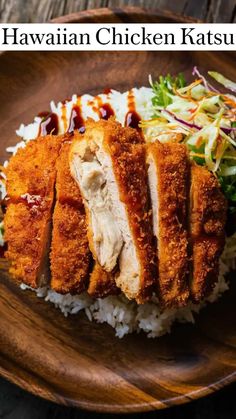 a plate with rice, chicken and coleslaw on it that says hawaiian chicken katsuu