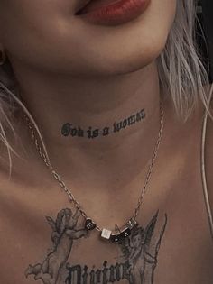 a woman with tattoos on her chest and neck