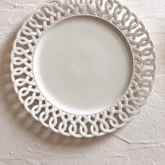 a white plate sitting on top of a table