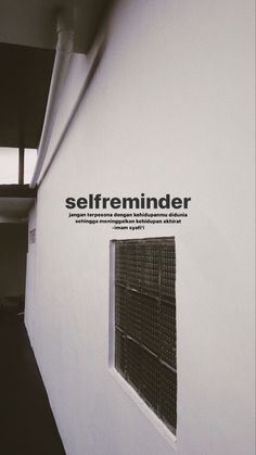 an advertisement for selfreminder on the side of a white building with windows