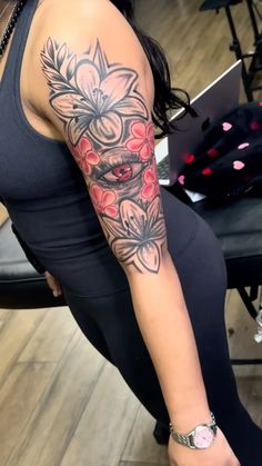 a woman with a tattoo on her arm