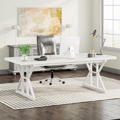 a white desk in an office with a chair and rug on the floor next to it