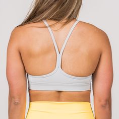 We custom-designed this sports bra for the active woman. Custom-designed for athletes looking for freedom and function. Our 2-Strap Narrow Back Sports Bra provides the perfect amount of support you need to keep you covered, comfortable, and looking SAVAGE during your entire workout. Made with the perfect Nylon/Spandex blend that is moisture-wicking, breathable, antibacterial, and gives you all the 4-way stretch you will ever need. Removable inserts also will allow you to adjust your new bra to y Supportive Sports Bra With Built-in Bra For Light Sports, Functional Gym Bra With Built-in Padding, Supportive Sports Bra With Built-in Padding For Light Sports, Functional T-back Sports Bra For Workout, Supportive Gray Sports Bra With Built-in Bra, Gray Racerback Sports Bra With Built-in Bra, Racerback Training Bra With Built-in Padding, Sports Bra With Built-in Padding And Racerback, Sports T-back Bra With Built-in Support