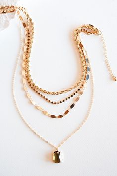 The Emily Layered Chain Necklace is a stunning accessory that effortlessly combines glamour and sophistication. This necklace features multiple layers of delicate gold chains, elegantly cascading around the neckline. Each layer is adorned with clear or topaz crystal drop, adding a touch of sparkle and allure. The combination of the crystals and the layered chains creates a captivating and dynamic look. The Emily Layered Chain Necklace is perfect for those special occasions when you want to make Topaz Crystal, Chain Necklace Gold, Layered Chain Necklace, Layered Chain, Necklace Ideas, Layered Chains, Gold Necklace Layered, Layering Necklace, Crystal Drop