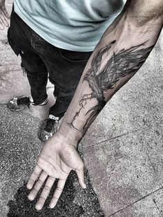 a man with a tattoo on his arm