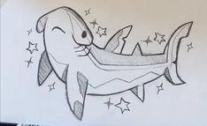 a drawing of a shark with stars on it's back and the tail sticking out