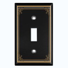 a black and gold light switch plate with an ornate design on the front cover,