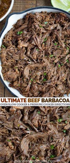 the ultimate beef barbacoa recipe in a cast iron skillet with lime wedges