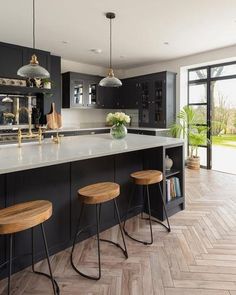 an instagram page with two stools in front of a kitchen island