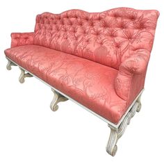 an old fashioned pink couch is shown on a white background