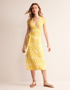 Can you ever have too many jersey dresses? Not when they’re this versatile. The Joanna midi dress is made from wear-all-day comfortable jersey and has a classic wrap style and blouson sleeves. Jersey Dresses, Passion Fruit, Yellow Dress, Jersey Dress, Cap Sleeve, Wrap Style, Fit And Flare, Cap Sleeves, Swirl