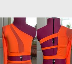 an orange and purple dress with zippers on it