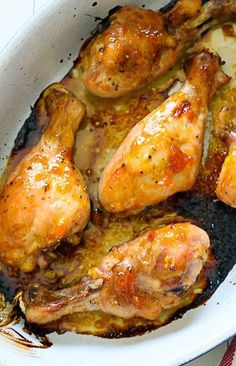 some chicken is cooking in a pan on the stove