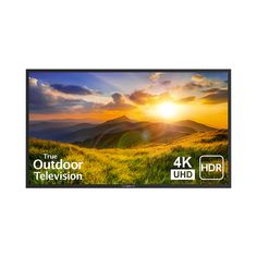 the outdoor television is on display in front of a beautiful mountain scene with clouds and sun