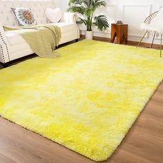 a bright yellow area rug in a living room