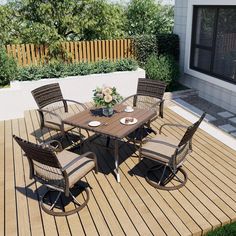 a table and chairs on a wooden deck