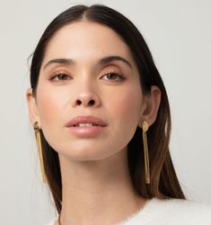 Make a statement with these slinky tassel earrings, the ultimate show-stoppers. They're perfect for that holiday party or adding an extra dash of glam to your dress-up occasions. Chic Tassel Earrings For Evening, Elegant Evening Tassel Drop Earrings, Minimalist Tassel Earrings For Party, Elegant Long Drop Tassel Chandelier Earrings, Elegant Long Drop Chandelier Earrings With Tassels, Chic Gold Linear Earrings For Evening, Modern Long Drop Earrings For Party, Glamorous Evening Tassel Earrings For Pierced Ears, Trendy Tassel Drop Earrings For Evening