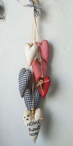 several heart shaped ornaments hanging on a wall