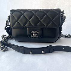 Chanel Mini Flap Bag, Black With Adjustable Cross Body Chain/Leather Strap And Top Handle. 7 1/2” X 5 1/2” X 2” 46 1/2” Cross Body Strap High-end Double Flap Shoulder Bag With Removable Pouch, High-end Shoulder Bag With Double Flap And Removable Pouch, High-end Shoulder Bag With Removable Pouch And Double Flap, High-end Double Flap Shoulder Bag With Detachable Strap, High-end Shoulder Bag With Detachable Strap And Double Flap, High-end Black Square Flap Bag, High-end Rectangular Shoulder Bag With Chain Strap, Luxury Evening Double Flap Shoulder Bag, Luxury Double Flap Shoulder Bag With Removable Pouch