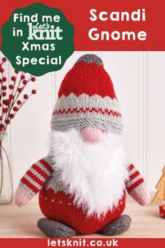 a knitted santa clause sitting on top of a table