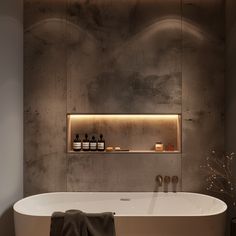 a white bath tub sitting in a bathroom next to a shelf with bottles on it