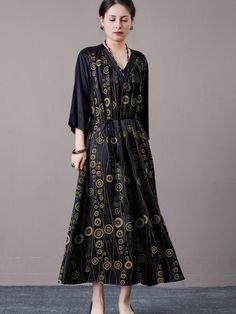 Step out in style with this black and gold geometric print maxi dress. Featuring a striking geometric pattern and a flattering V-neckline, this dress exudes elegance and sophistication. The cinched waist and flowing silhouette provide a comfortable and chic fit, perfect for both formal occasions and stylish everyday wear. Pair with bold accessories and heels for a complete, polished look. Key Features: Black and gold geometric print V-neckline for a flattering look Cinched waist for a chic fit Flowing silhouette for comfort Suitable for formal occasions and everyday wear Spring Gold Floor-length Maxi Dress, Gold Bohemian V-neck Dress, Black Bohemian V-neck Midi Dress, Gold Maxi Dress For Spring, Flowy Black Maxi Dress With V-neck, Black Flowy V-neck Maxi Dress, Chic Black Maxi Length V-neck Dress, Chic Black Maxi V-neck Dress, Chic Black V-neck Maxi Dress