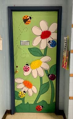 a door decorated with flowers and ladybugs