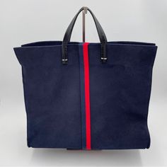 Clare V Perforated Suede Leather Tote Bag Navy & Red The Iconic Tote Bag From Clare V (And As Seen On Working Moms!) Is So Classy, So Versatile And So Perfect. Holds Everything You Need For Work, Shopping Or Just Being Out And About. Made Of Very Soft Navy Suede, Denim Lined, Leather Handles & Long Leather Shoulder Strap. Has Metal Studs On The Bottom To Protect It. Has A Bit Of A Nautical Feel To It. This Bag Is Near Perfect. No Stains, Snags, Or Loose Stitches. Looks Basically Brand New. Comes Clare V, Clare V., Have Metal, Working Moms, Large Tote Bag, Leather Handles, Large Tote, Leather Tote Bag, Leather Handle