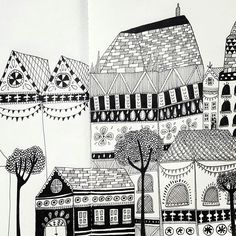 a black and white drawing of buildings with trees