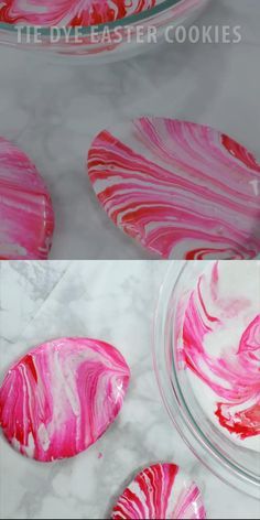 pink and white marbled paper plates with red swirls on them, sitting on a table