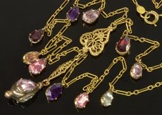 "Presented is an elegant Georgian Paste swag necklace. This necklace was made by a jewelry designer who placed original Georgian 9K gold foil back paste drops on 14K Art Deco swag chain. The pastes are of amethyst, garnet and topaz colors as real droplets of water. The bright glitter is due to the foil typically placed by Georgian jewelers behind pastes as well as gems. The drops are 1/4\" tall. The top and bottom swags are connected with a filigree station. The necklace is completed with the 3- Vintage Gold Briolette Necklace, Victorian Gold Teardrop Necklace, Gold Drop Necklaces With 17 Jewels, Gold Drop Necklace With 17 Jewels For Anniversary, Victorian Antiques, Necklace C, Georgian Jewelry, Edwardian Jewelry, Topaz Color