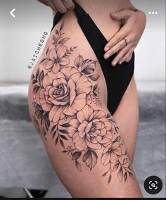 a woman's thigh with flowers on it