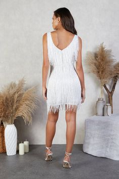 https://player.vimeo.com/external/542647727.hd.mp4?s=1e99d5c8b46d97b10edeea47f563add2f08dc489&profile_id=175 Glamorous V-neck Fringe Dresses, White Mini Dress For Prom And Party Season, Fitted Beaded Fringe Dresses For Prom, White Glamorous V-neck Sequin Dress, White Glamorous Mini Dress For Prom Season, White Glamorous Mini Dress For Prom, Glamorous White Mini Dress For Prom Season, Glamorous White Mini Dress For Prom, Fitted Beaded Fringe Prom Dress