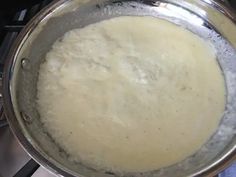 a pan filled with food sitting on top of a stove next to a burner