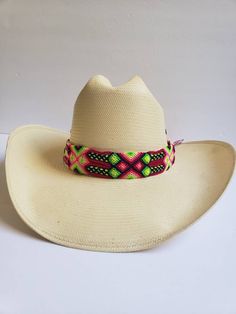 Give life and style to your hat with this beautiful Multicolor Braided Boho hat band, perfect to spice your western- Bohemian outfit, Ajustable, handcrafted by Huichol Hands in Mexico! 1.6' width, 19.5 Length without the stripe, 44'with stripe. Dale vida y estilo a tu sombrero con esta hermosa banda para sombrero bohemia multicolor, perfecta para complementar tu atuendo, ajustable ¡hecha a mano por Manos Huicholes en México! Adjustable Short Brim Sun Hat For Rodeo, Multicolor Fedora With Short Brim For Rodeo, Multicolor Short Brim Fedora For Rodeo, Multicolor Fedora With Curved Brim For Rodeo, Adjustable Multicolor Hat For Western-themed Events, Multicolor Brimmed Fedora For Rodeo, Multicolor Flat Brim Straw Hat For Rodeo, Adjustable Beaded Western Fedora, Western Adjustable Beaded Fedora