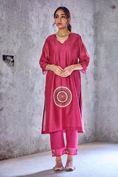 Dark pink kurta with mirror embroidered placement motif.
Component: 1
Embroidery
Neckine: V neck
Sleeve Length: Three fourth
Fabric: Chanderi
Color: Pink
Kutch hand embroidery
Scallop hem on sleeves
Side slits
Note: Pant and dupatta worn by model are not for sale. - Aza Fashions Pink V-neck Bollywood Style Kurta, Chanderi Kaftan With Mirror Work For Festivals, Festive Chanderi Kaftan With Mirror Work, Festival Chanderi Kaftan With Mirror Work, Festivals Straight Kurta Kaftan With Gota Work, Festival Straight Kurta Kaftan With Gota Work, Festive Chanderi V-neck Kurta, Festival Chanderi Kaftan With Gota Work, Eid Chanderi Kaftan With Mirror Work