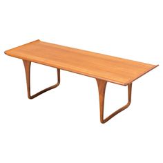 a wooden table sitting on top of a white background