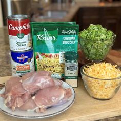 ingredients to make chicken broccoli salad on a counter with bowls and spoons