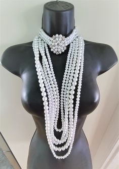 "Hello, welcome to Ken's Closet Today we have a beautiful Peral Body Crystal Choker Necklace. This necklace has 3 strands of pearls on the choker. The choker has a beautiful ornament, that is a mix of pearls and crystals. The necklace is 15\" long with a 2\" adjustable chain. The total length that would hang in the front is 19\" The dangling section is made of 5 stands in different size pearls and staggered lengths. This set is very sparkly and would look great on any stage or special event. Cry Silver Crystal Necklace, Jewelry Royal, Body Necklace, Crystal Choker Necklace, Necklace Diamond, Crystal Choker, Silver Crystal, Blue Bracelet, Diamond Crystal