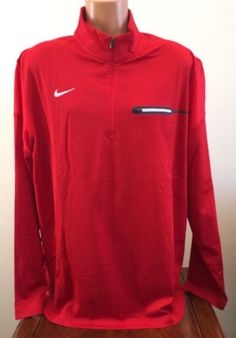 We love to combine shipping!  ~ Nike ~  Men's 1/2 Zip Pullover Shirt Style: 746960 - Color: 658 Red - Size: 2XL ~ Brand New with Tags ~ Mock neck 100% Polyester exclusive of decoration Dri-FIT helps pull sweat away to keep you dry and comfortable 1/2 zip Front left chest zip pocket Armpit to armpit measures approx. 27" Armpit to end of sleeve approx. 21.5" Armpit to hem approx. 19.25" Back neck seam to hem approx. 30.5" Side neck seam to end of sleeve approx. 33.25" I want my Casual Long Sleeve Sports Shirt, Nike Casual Top In University Red, Short Sleeve Sports Tops For Fall, Casual Red Half-zip Top, Red Long Sleeve Sports T-shirt, Casual Half-zip Sports Tops, University Red Long Sleeve Sporty Tops, University Red Long Sleeve Tops For Winter, University Red Long Sleeve Top