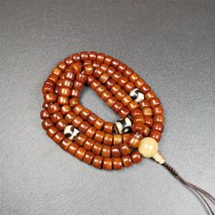 ❤This mala was made by Tibetan craftsmen and come from Hepo Town, Baiyu County, the birthplace of the famous Tibetan handicrafts.It is made of yak bone, brown color,108 dice beads diameter of 10mm / 0.4",circumference is 84cm / 33",and 3 dzi beads,end of a yak horn guru bead.❤DETAILS100% HandmadeMaterial:yak bone,yak horn,dzi beadSize:Mala Circumference:84cm/ 33 inch108 × yak bone beads, size:10mm/ 0.4 inch1 × 3 eyes mandala dzi bead, size:15 × 12mm/ 0.6 × 0.47 inch2 × tiger tooth dzi beads, siz Tibetan Yak, Lotus Sutra, Tiger Tooth, Nothing Is Permanent, Buddhist Teachings, Om Mani Padme Hum, Water Buffalo, 3rd Eye, Everything Is Possible