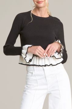 add a playful twist to your wardrobe with this bell sleeve color block sweater. the fitted silhouette and ribbed texture offer a sleek look, while the ruffled hem and sleeves with contrasting black and white detailing create a bold, feminine flair. perfect for dressing up or down, this sweater adds instant sophistication to any outfit, making it a must-have for the season. 50% viscose | 28% polyester | 22% nylon model is wearing a size small Outfit Making, Ribbed Texture, Color Block Sweater, Fitted Silhouette, Romper With Skirt, Sleek Look, Dress Romper, Hat Hairstyles, Bell Sleeve