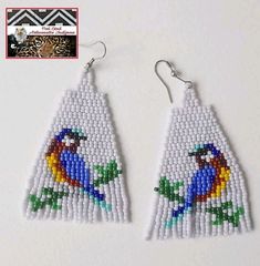 the beaded earrings are decorated with colorful birds