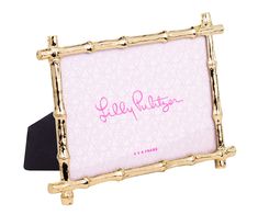 a pink and gold bamboo frame with the word'ugly things'written on it